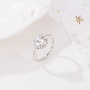 Detailed macro of a halo ring with a large round cubic zirconia and micro-pave band
