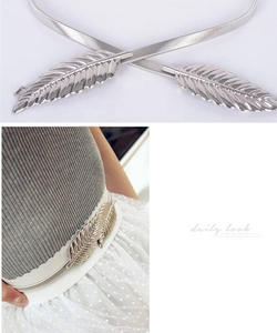 Detailed view and model shot of a silver leaf buckle elastic spring metal waist chain