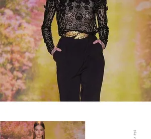 Detailed close-up of a gold leaf metal waist chain styled on a black lace floral top
