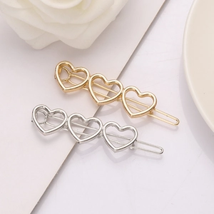 Minimalistische Haarspangen in Gold und Silber mit dreifachem hohlem Herz-Design