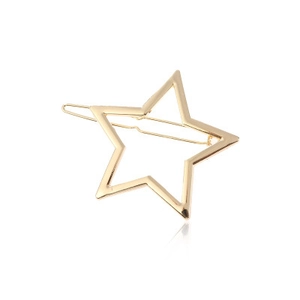 Detail of creative gold alloy hair clip with a minimalist hollow star shape and polished finish