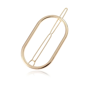 Detailed close-up of a minimalist oval golden alloy hair clip with a high-polished mirror finish