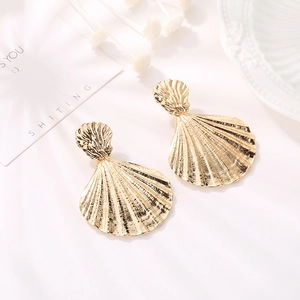 Elegant gold shell drop earrings featuring a double scallop design with textured metal finish