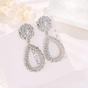 Textured silver-plated teardrop earrings with organic lava-like surface for women