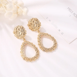 Artistic gold-tone waterdrop earrings with textured surface and vintage drop design