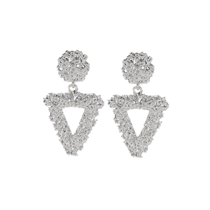 Silver triangle earrings with textured lava pattern and industrial hollow design style