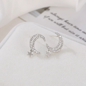Sparkling silver star and crescent moon stud earrings with pavé cubic zirconia