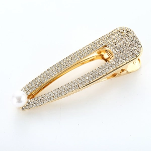 Barrette à cheveux élégante en métal doré ornée de strass brillants et d'une perle blanche