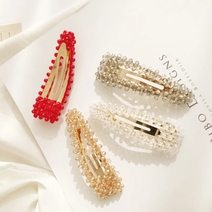 Set di quattro fermagli per capelli in perline di cristallo colorate con clip in metallo oro