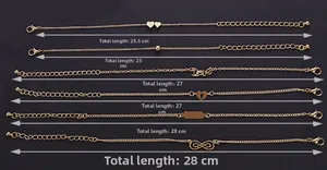 Detailed view of six gold infinity love bracelets with heart charms and lobster clasps