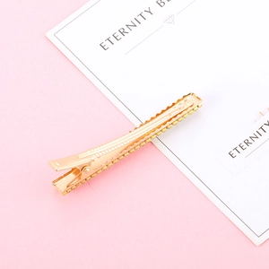 Barrette à cheveux dorée élégante avec strass brillants et finition polie ondulée