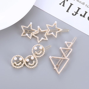 Set de trois barrettes dorées avec étoiles et perles artificielles pour femmes et filles
