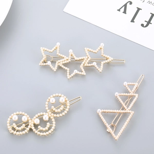 Coffret de barrettes à cheveux dorées avec perles et motifs d'étoiles et sourires