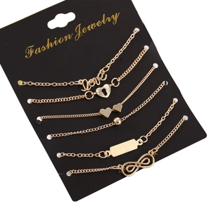 Set of six gold-tone fashion bracelets with love, heart, and infinity symbol charms