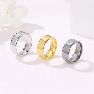 Set of three minimalist wide polished rings in silver, gold, and gun grey finishes