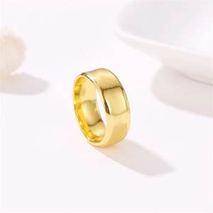 Minimalist wide smooth gold plated stainless steel ring shown from a 45-degree angle