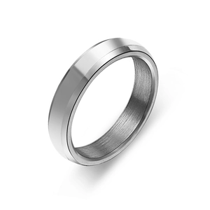 Macro view showing the polished beveled edge and brushed interior of the silver metal ring