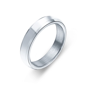 Detailed macro shot of a wide silver band ring featuring beveled edges and brushed inner texture