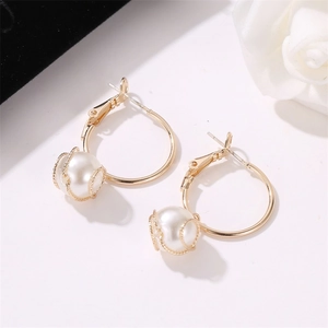 Minimalist gold hoop earrings with white pearls and delicate wire wrap mesh