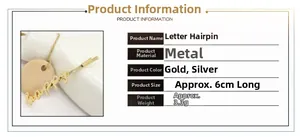 Detail view of happy letter hair clip in gold and silver showing 6cm size dimensions