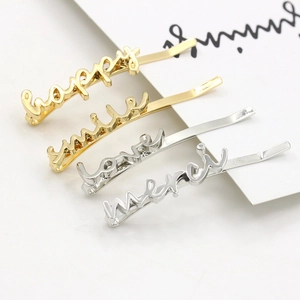 Minimalist alloy hair clip set with metallic Love and Smile letters in gold and silver
