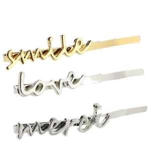 Three-piece metal letter hair clips set featuring gold smile and silver love merci designs
