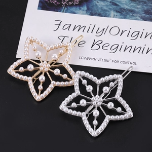 Lot de barrettes étoile évidées avec perles et strass en finitions dorée et argentée