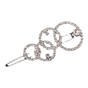 Barrette argentée avec quatre anneaux géométriques superposés et des strass brillants