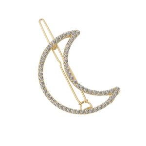 Eleganter goldener Haarclip in Mondsichelform mit funkelnden Strasssteinen