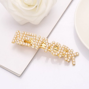 Barrette à cheveux NEWYORK perlée dorée élégante pour femme au style minimaliste