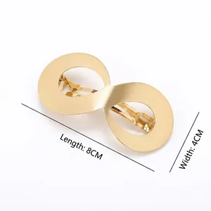 Grande barrette à cheveux dorée mate motif infini de 8cm pour un style minimaliste