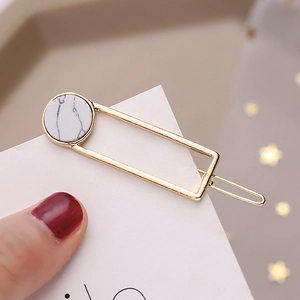 Minimalist gold hair clip with marble stone insert for women's elegant hair styling