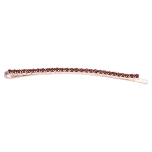 Elegant rose gold hair clip with deep red rhinestones on a minimalist metal base