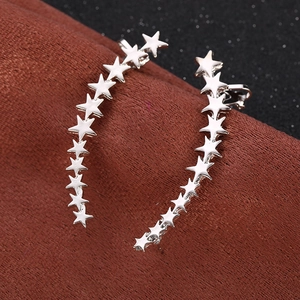 Polished silver star ear crawler featuring graduated five-point stars in a curved design