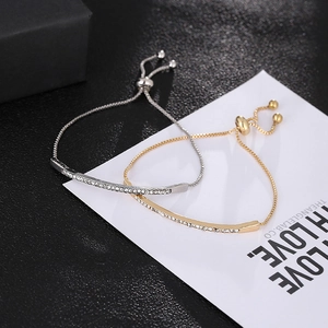 Adjustable crystal slider bracelets in gold and silver finish with minimalist zircon bar