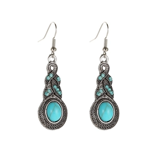 Vintage silver drop earrings with turquoise stones and blue rhinestones on white background
