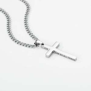 Polished stainless steel cross pendant necklace with 4:13 engraving on a cuban chain