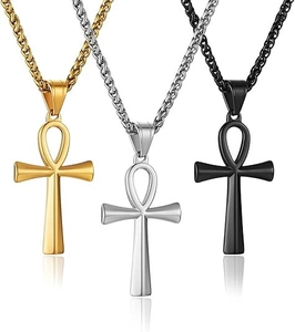 Detailed view of Ankh cross pendants in gold, silver, and black with wheat chains