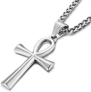 Macro detail of silver Ankh cross pendant with a polished wheat chain necklace