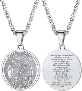 Close-up of Saint Michael medal necklace showing protective prayer text on the back
