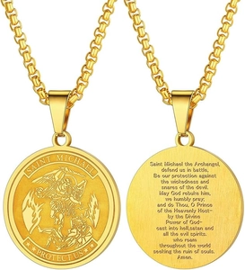 Detailed view of Saint Michael gold pendant showing the prayer engraving on the back side