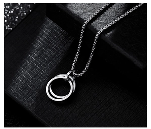 Detail of interlocking silver double rings on a box chain for a modern hip-hop necklace