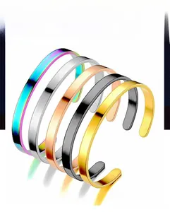 Detailed view of C-shaped stainless steel cuffs in rainbow, silver, gold, and black finishes