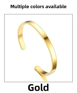Detailed view of wide flat gold plated stainless steel open C-shaped cuff bracelet