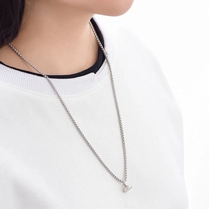 Astronaut magnetic couple necklace in polished silver finish on a box chain