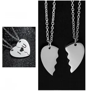 Detail view of silver stainless steel heart puzzle necklace with custom I Love You engraving