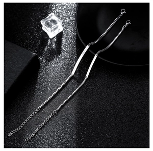 Detailed view of two-piece silver stainless steel box chains with polished bar plates