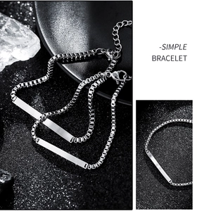 Detail of polished stainless steel bar bracelet with lobster clasp and extension chain
