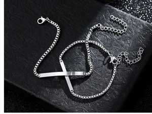 Macro view of silver rectangular tag chain bracelets with lobster clasp in gift box