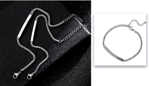 Detailed macro view of polished titanium steel box chain bracelet with curved blank ID tag